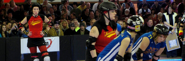 Jammers skating through the pivots and blockers … Queen City Roller Girls